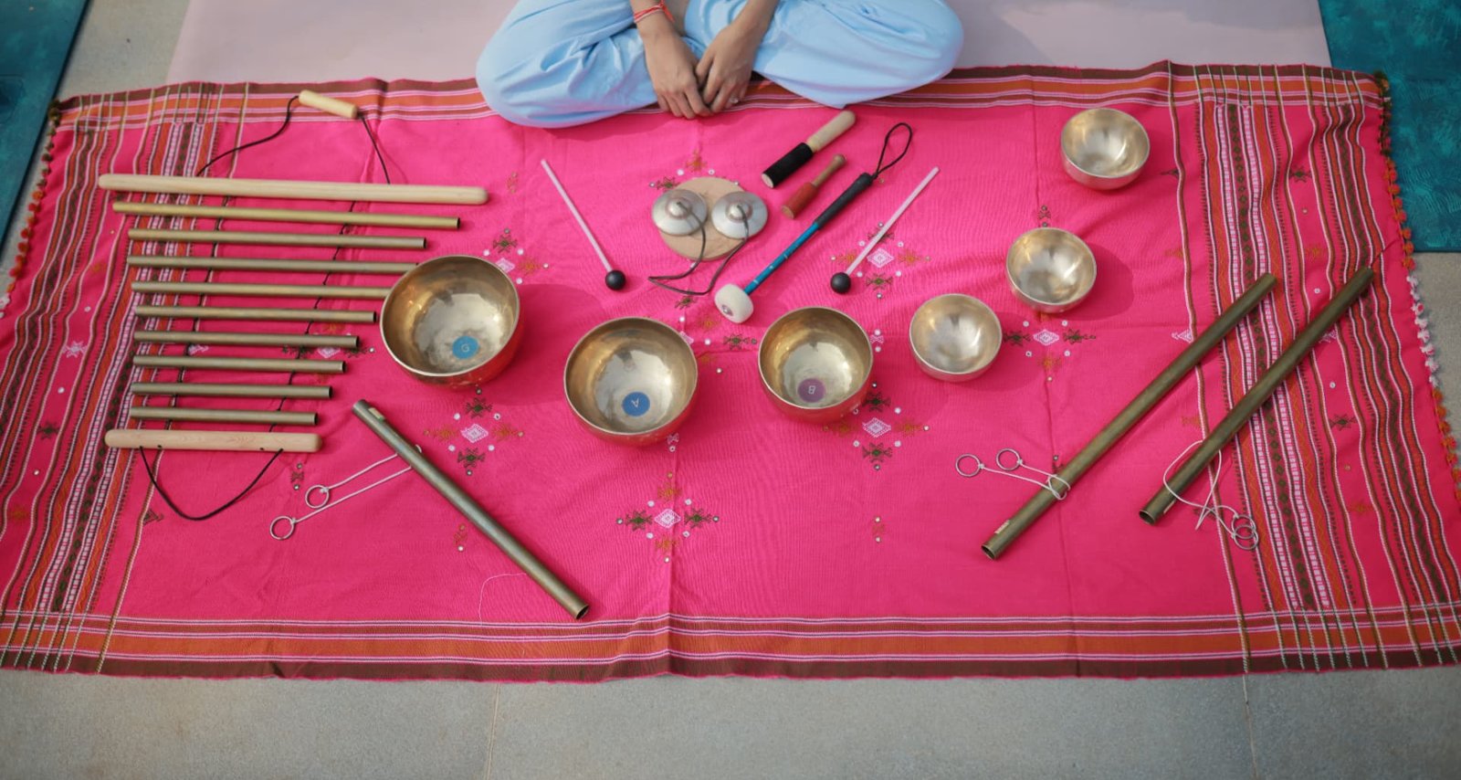 Sound healing instruments laid out for a session