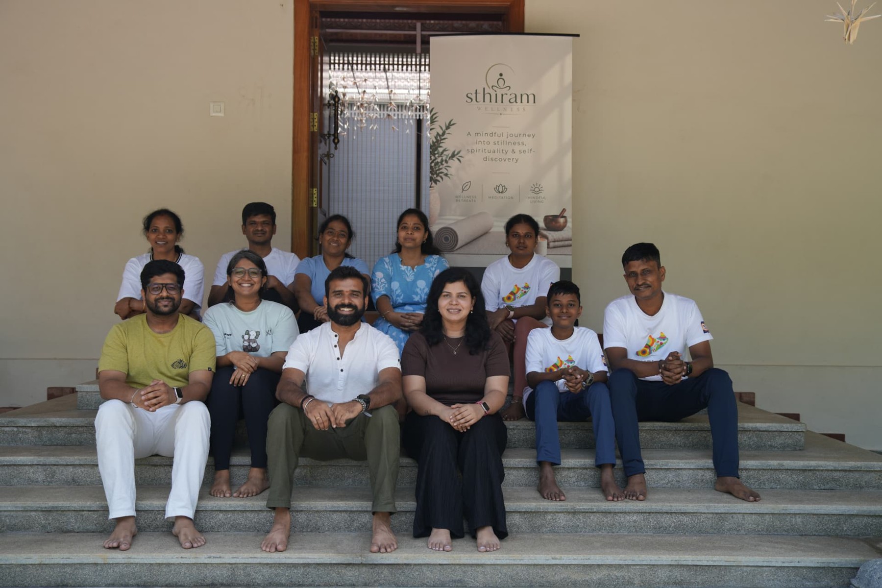The Sthiram community gathered on the steps at a previous meetup